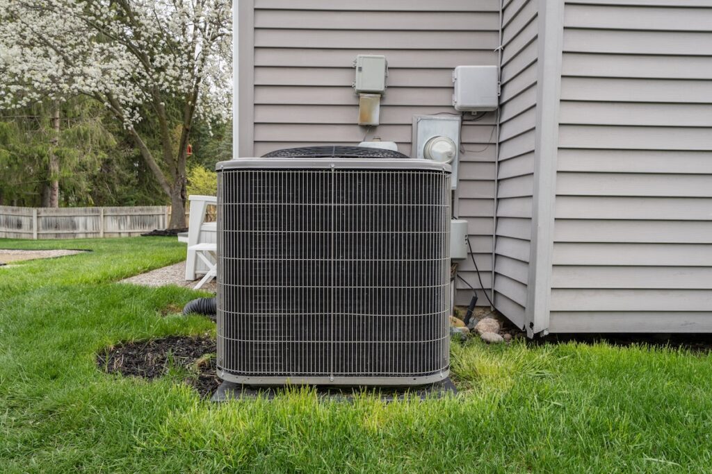 air conditioner condeser unit and system has been installed in a backyard best air conditioner brands