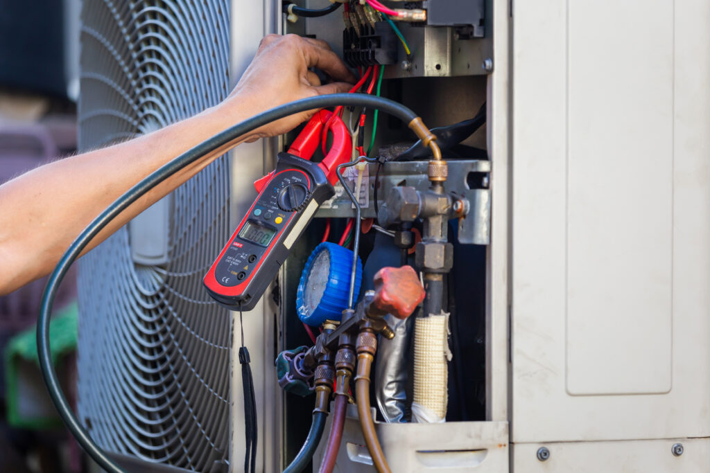 Air Conditioning Repair man hands checking and fixing modern air conditioning system, Technician team checking leakage air conditioning system ac tune up