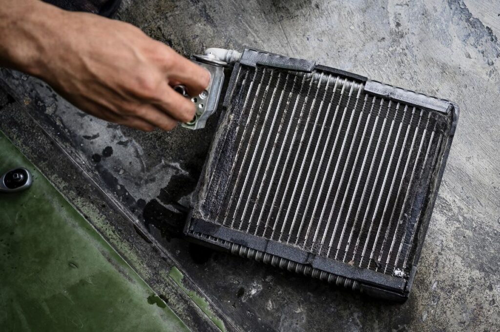 Close-up of car air conditioning evaporator coil leaks