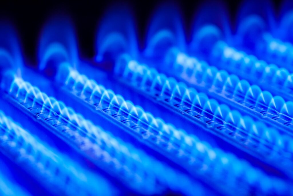 Propane flame inside of gas boiler furnace