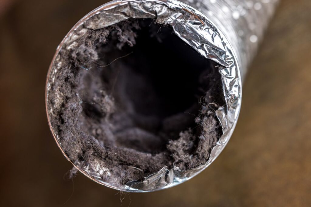 ductwork filled with lint, dust and dirt