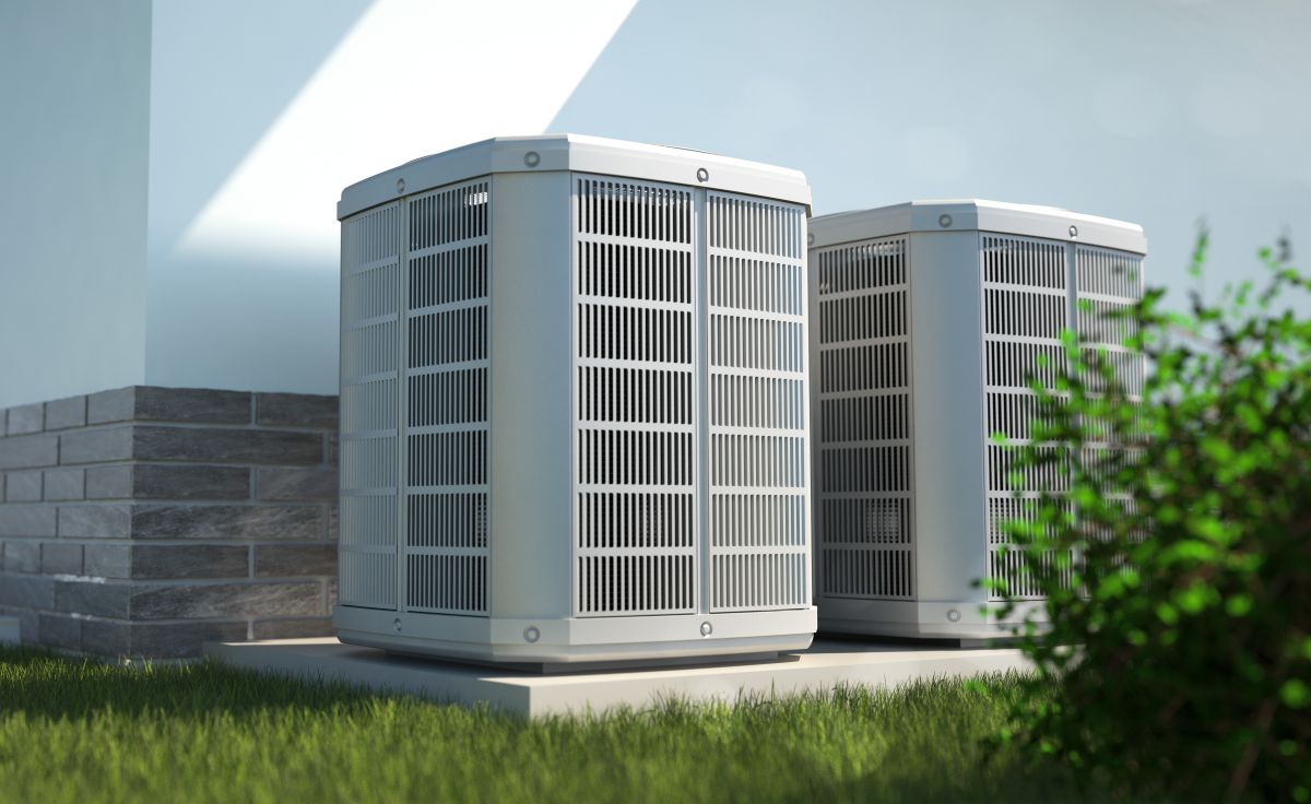 Air heat pumps beside house